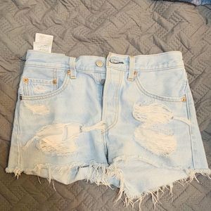 Levi’s light blue distressed high waisted shorts